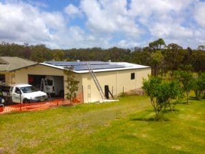 front shed with SolaXs solar panel roof